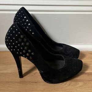 Black suede high heels with studded details
